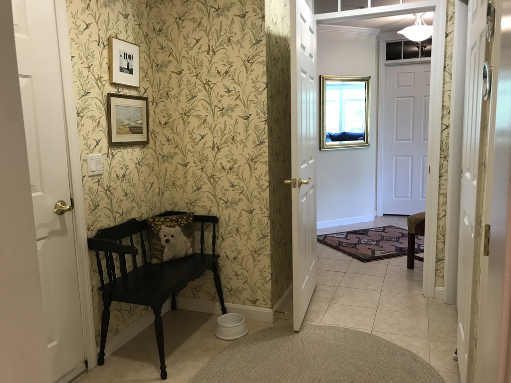 Entry to hall and kitchen from two car garage/coat closet mud room