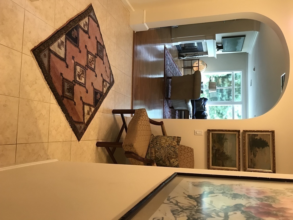 Entry Hall with guest bath and office on left, mudroom from garage on right