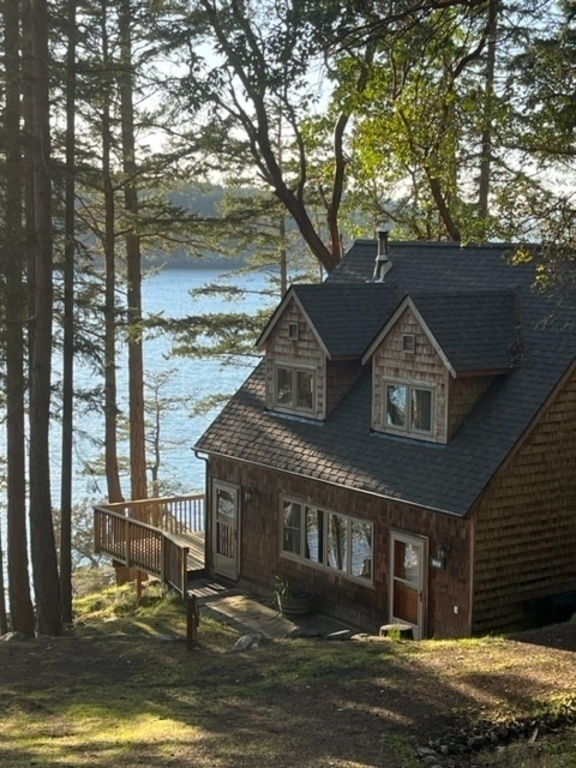Waterfront cottage nestled among the trees