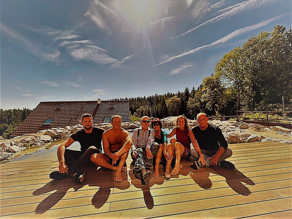 On our sundeck at the swimming pond in front of the house :)