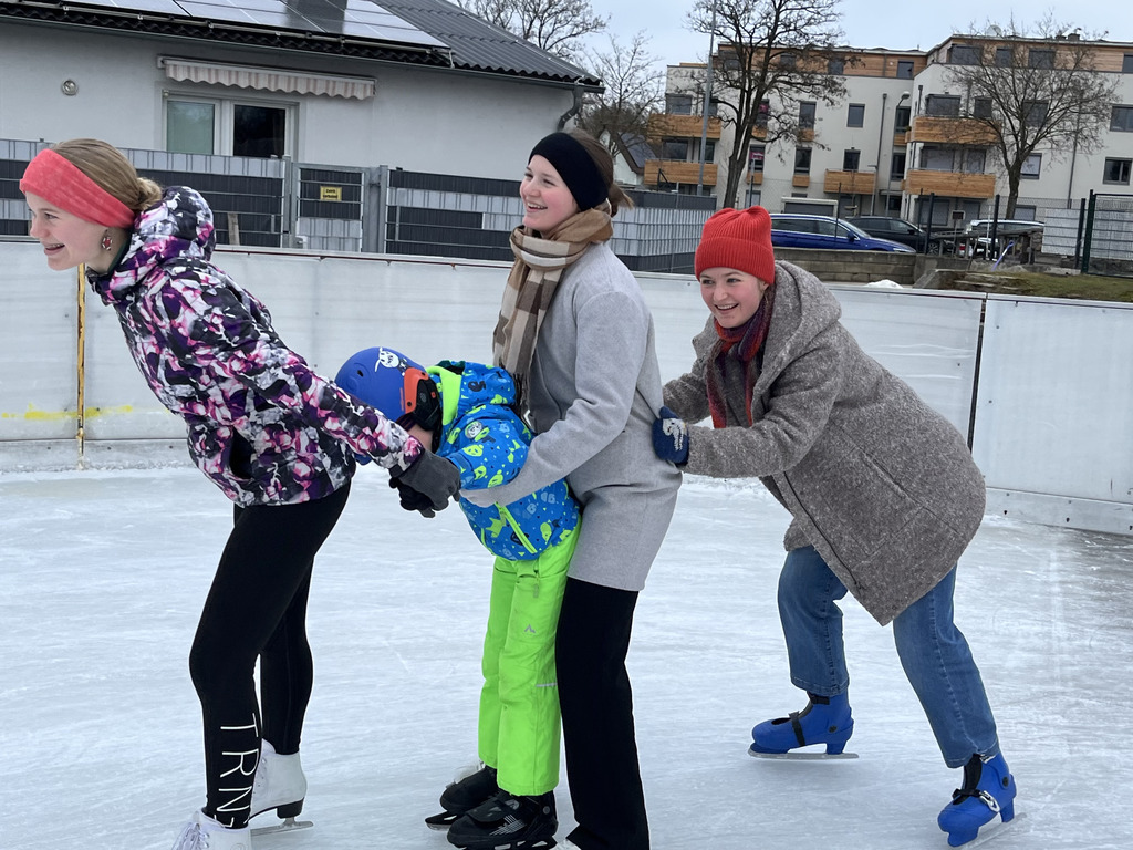 All the kids together doing ice-skating