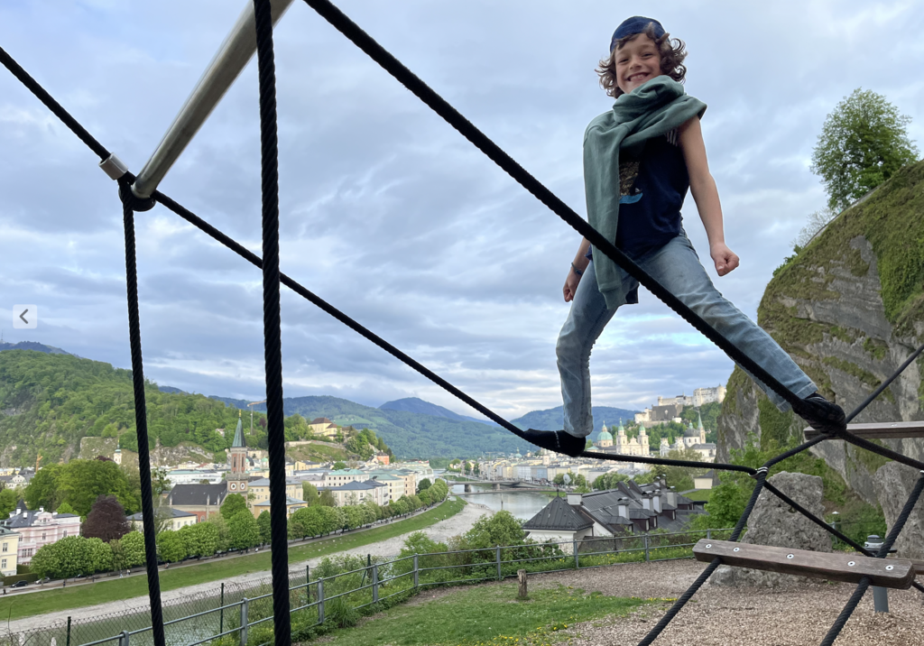 Jaron on a playground above Salzburgs old town.