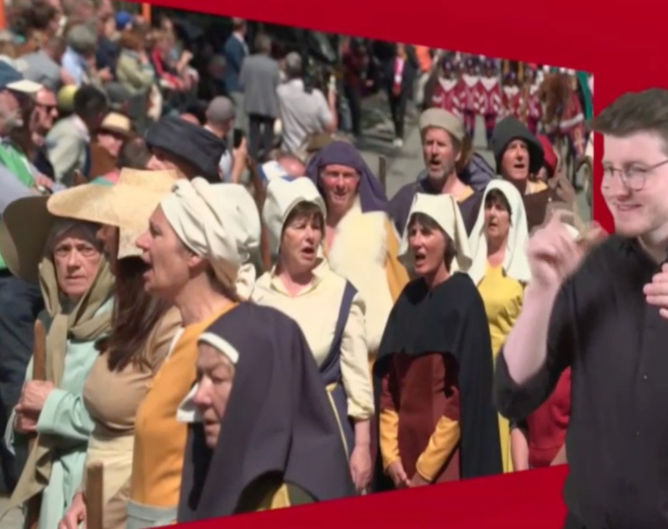 Singing Michele( orange dress) in the Holy Blood Procession  (May 2023)