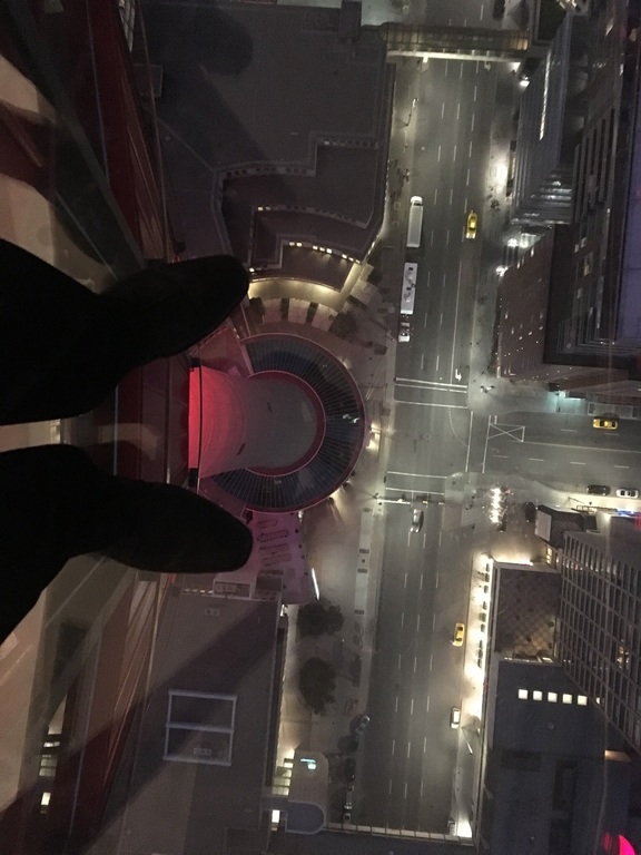 Looking down through glass floor of Calgary Tower, 200 meters down!