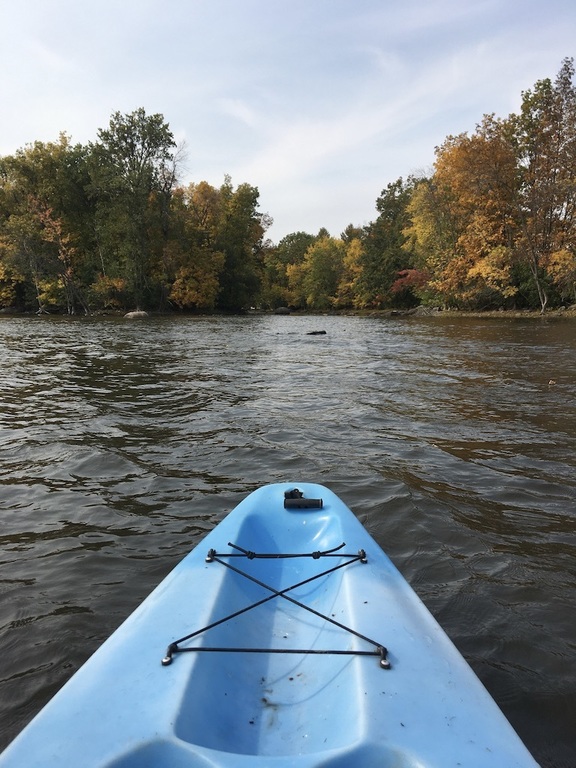 Kayak on the river in front of the house.