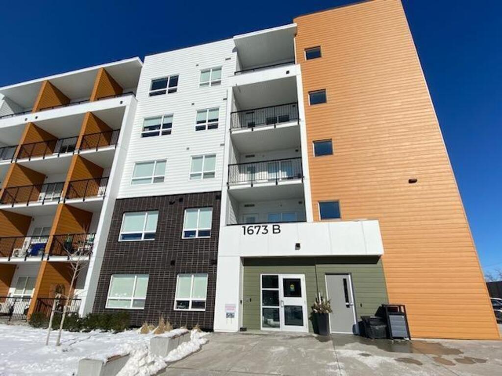 Apartment front. The 2 windows to the left on the main floor are where we live. 