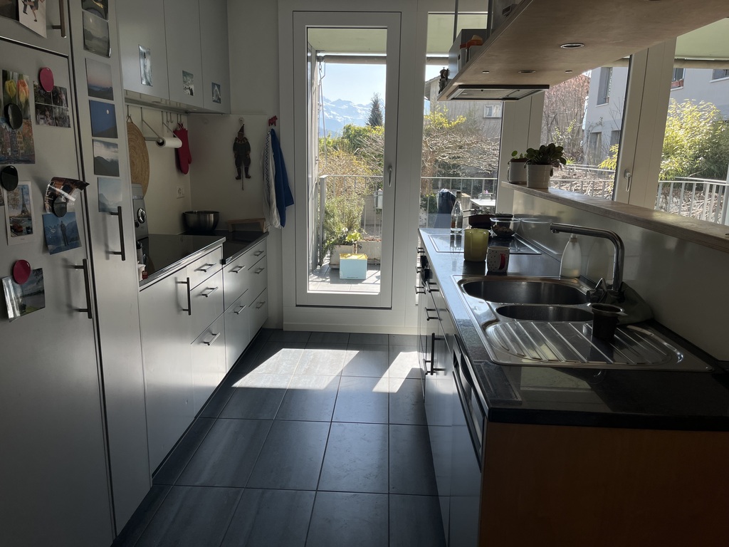 Kitchen with direct access to the balcony with dining area