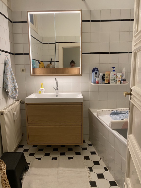 one of two bathrooms with bathtop
