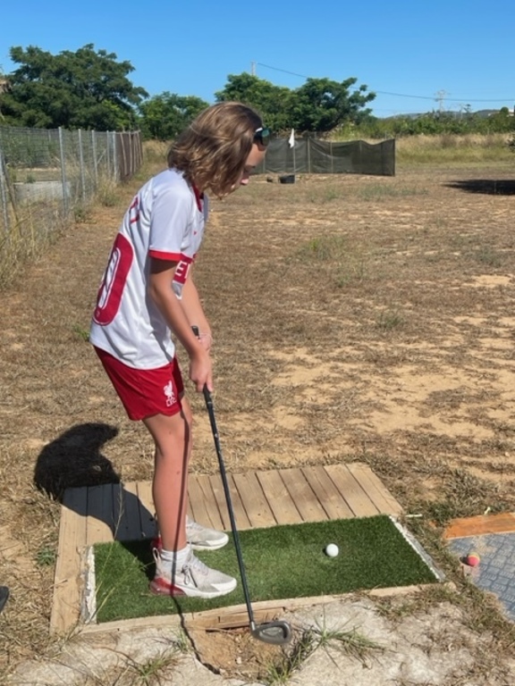 Grandaughter practicing a bit of golf