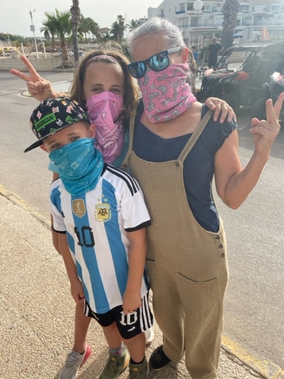 Sue getting ready for a dune buggy ride with the grand children 2023