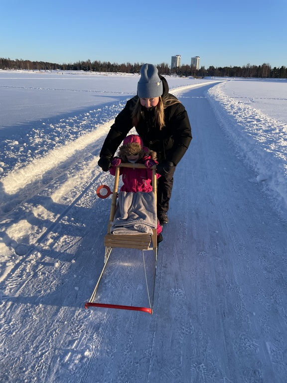 Emma and Erin on the sea during winter
