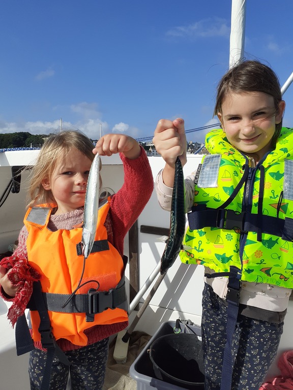 Our grand daughters are learning how to fish at sea