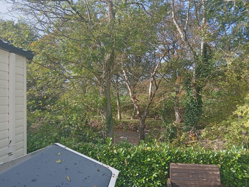 River is behind caravan