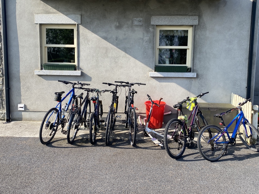 so many bikes at the rack at the back of the house