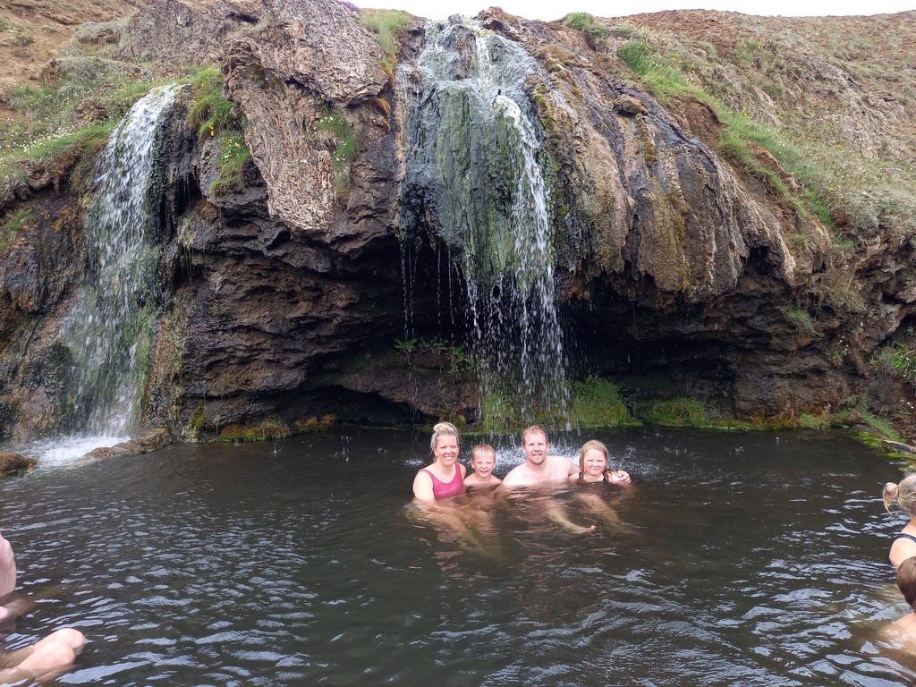 Hot natur pool and waterfall in east Iceland