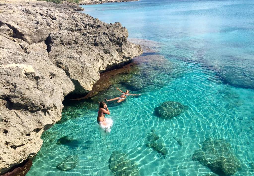 Our daughter splash in the clear sea!