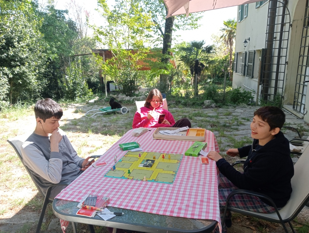 playing board games in the garden with my 3 kids