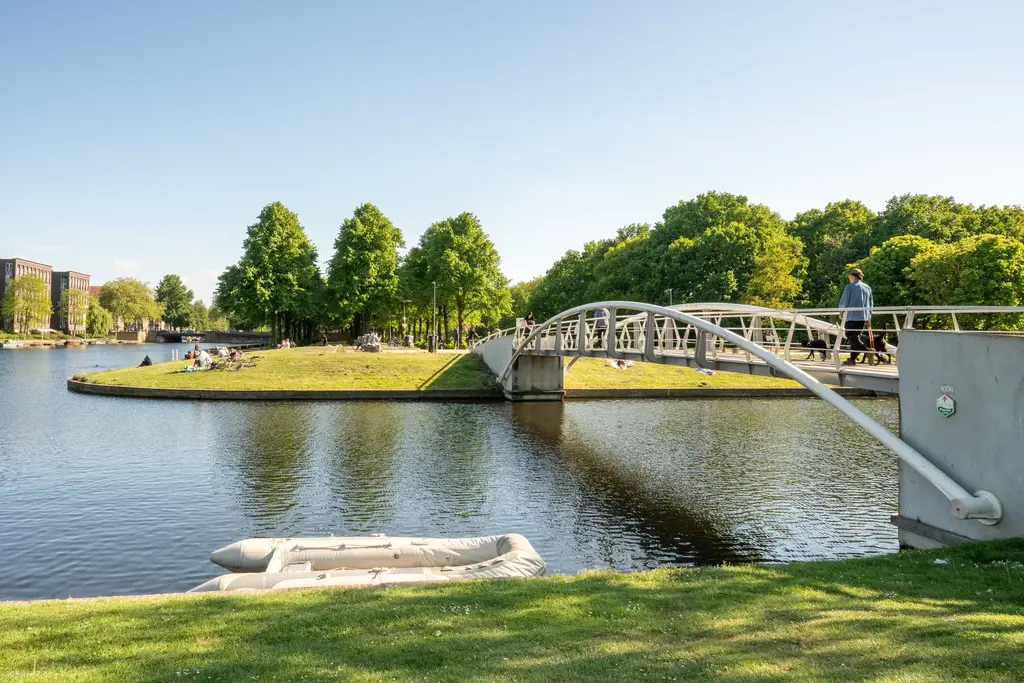 At the end of the street 200m walk you can cross the Bridge to the Erasamus parc. You can also swim in the Erasmus Canal there.