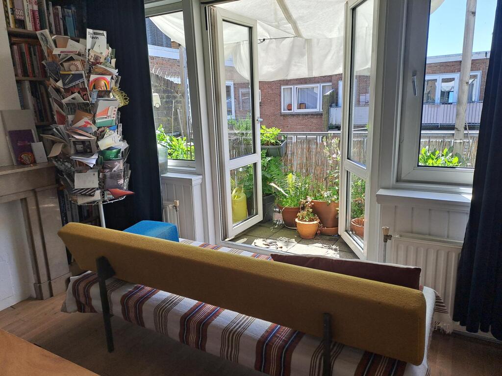 Our study, with access to the balcony (where Kim grows dahlia's). Between April and July, the air is buzzing with swifts.
