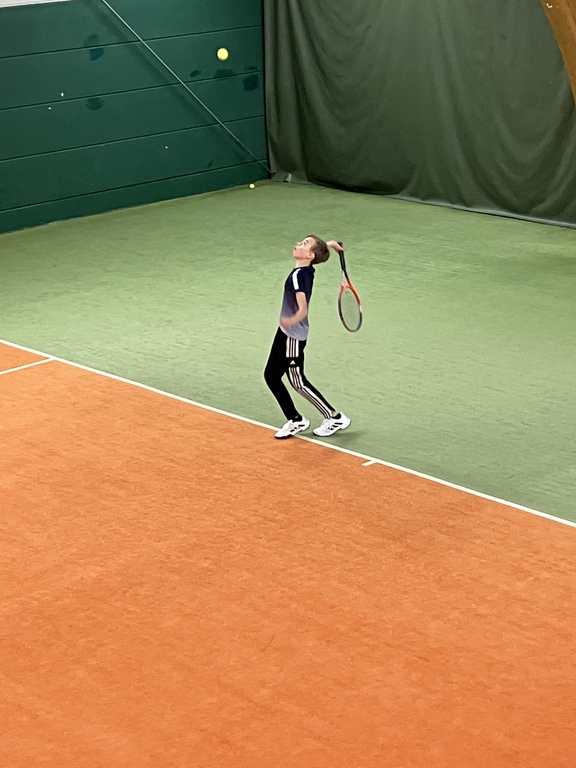 My son playing tennis