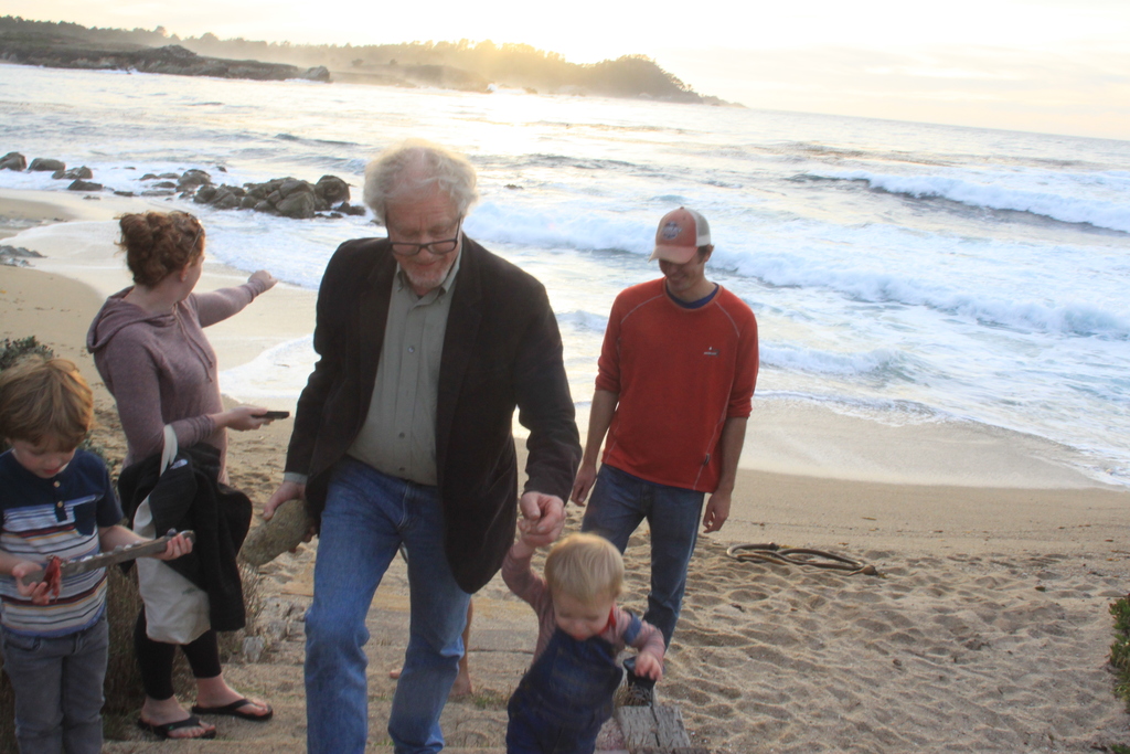 Colin on the beach with grandkids