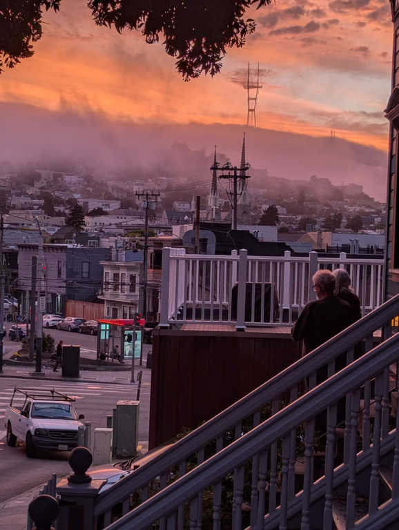 We watch the fog coming in at sunset from our front steps.