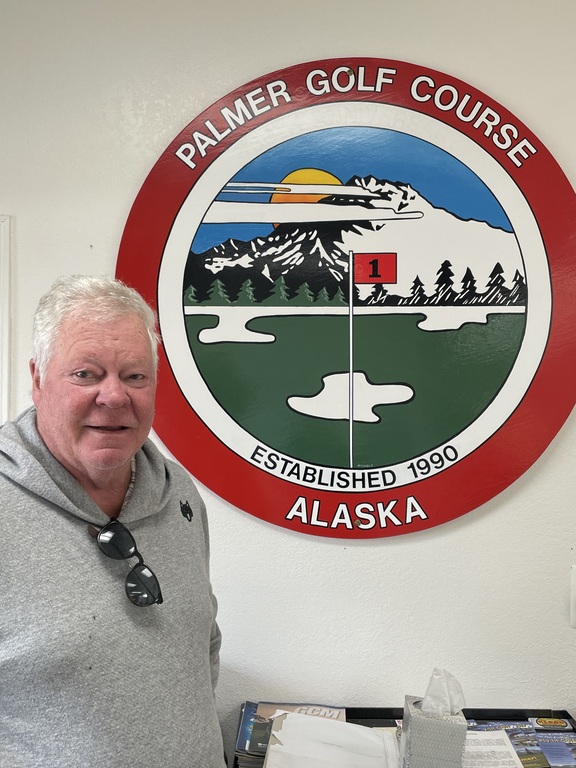 Zints playing golf in Alaska